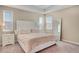 Inviting main bedroom with plush carpeting and large windows for ample natural light at 8321 Bryce Canyon Ave, Windermere, FL 34786