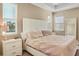 Bright main bedroom features soft lighting, ample natural light, and neutral decor at 8321 Bryce Canyon Ave, Windermere, FL 34786