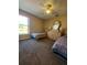 Bedroom featuring carpet floors, two twin beds, a dresser, and a ceiling fan at 8630 Knottingham Dr, Kissimmee, FL 34747