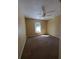 Neutral bedroom features a window and ceiling fan for comfortable living at 8630 Knottingham Dr, Kissimmee, FL 34747