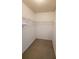 Small closet with wire shelving and neutral carpet at 8630 Knottingham Dr, Kissimmee, FL 34747