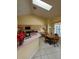 Cozy kitchen featuring matching appliances, skylights, and breakfast nook at 8630 Knottingham Dr, Kissimmee, FL 34747