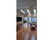 Bright and airy living room with skylights, gleaming hardwood floors, and comfortable seating at 8630 Knottingham Dr, Kissimmee, FL 34747