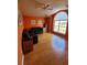 Bright living room featuring hardwood floors, an arched window and a modern ceiling fan at 8630 Knottingham Dr, Kissimmee, FL 34747