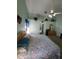 Spacious main bedroom featuring carpet floors, vaulted ceilings, and decorative plants at 8630 Knottingham Dr, Kissimmee, FL 34747