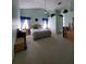 Spacious main bedroom featuring carpet floors, vaulted ceilings, and natural light at 8630 Knottingham Dr, Kissimmee, FL 34747
