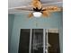 Leaf-blade ceiling fan, with lighting, accents covered outdoor patio at 8630 Knottingham Dr, Kissimmee, FL 34747