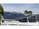 This home features solar panels and skylights on the roof, as well as a screened in pool area at 8630 Knottingham Dr, Kissimmee, FL 34747