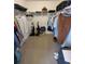 Walk-in closet with wire shelving, neutral carpet, and storage space at 8630 Knottingham Dr, Kissimmee, FL 34747