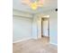 Cozy bedroom featuring carpet, ceiling fan, and a closet at 8923 Azalea Sands Ln, Davenport, FL 33896
