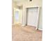 Bedroom showing carpet, bi-fold closet doors, and door to another room at 8923 Azalea Sands Ln, Davenport, FL 33896