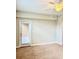 Neutral bedroom with ceiling fan and balcony access through sliding glass doors at 8923 Azalea Sands Ln, Davenport, FL 33896