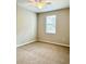 Carpeted bedroom with neutral walls, a ceiling fan, and a window at 8923 Azalea Sands Ln, Davenport, FL 33896