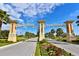 ChampionsGate entrance with a lush green landscape and palm trees lining the street at 8923 Azalea Sands Ln, Davenport, FL 33896