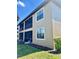 Exterior view of the condo featuring the screened lanai and manicured lawns at 8923 Azalea Sands Ln, Davenport, FL 33896