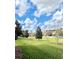 Wide shot of lush green lawns and tree-lined community at 8923 Azalea Sands Ln, Davenport, FL 33896