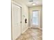Hallway area with doors and light beige walls at 8923 Azalea Sands Ln, Davenport, FL 33896
