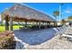Poolside tiki hut with lounge chairs and a beautiful view at 8923 Azalea Sands Ln, Davenport, FL 33896