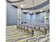 Comfortable seating in a modern theater featuring a projector and screen for entertainment at 8923 Azalea Sands Ln, Davenport, FL 33896