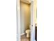 Small toilet room showing the toilet, tiled floor and white trim at 8923 Azalea Sands Ln, Davenport, FL 33896