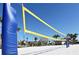 Community sand volleyball court with a net, ready for play at 8923 Azalea Sands Ln, Davenport, FL 33896