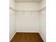 Spacious walk-in closet with wire shelving and carpeted floor at 8923 Azalea Sands Ln, Davenport, FL 33896
