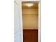 A glimpse into a walk-in closet with wire shelving and neutral walls at 8923 Azalea Sands Ln, Davenport, FL 33896