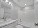 Modern bathroom with a white vanity, updated fixtures, and a shower-tub combination at 8960 Se 88Th Pl, Ocala, FL 34472