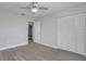 A well-lit bedroom with a ceiling fan, spacious closet and neutral tones throughout at 8960 Se 88Th Pl, Ocala, FL 34472