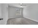 Comfortable bedroom bathed in natural light features gray vinyl flooring and a window at 8960 Se 88Th Pl, Ocala, FL 34472