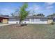 Charming single-story home featuring a well-maintained lawn and a welcoming front entrance at 8960 Se 88Th Pl, Ocala, FL 34472