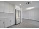 Bright kitchen showcasing white cabinetry, stainless steel appliances, and modern countertops at 8960 Se 88Th Pl, Ocala, FL 34472