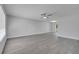Spacious living room features luxury vinyl plank flooring, recessed lighting and a ceiling fan at 8960 Se 88Th Pl, Ocala, FL 34472