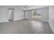 Inviting living room boasts luxury vinyl plank flooring, natural light and a ceiling fan at 8960 Se 88Th Pl, Ocala, FL 34472