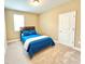Well-lit bedroom features neutral walls, plush carpet, and a cozy full-size bed at 9207 Busaco Park Way, Winter Garden, FL 34787
