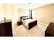 Inviting bedroom with neutral walls, carpet, dark wood furniture, and a bright window at 9207 Busaco Park Way, Winter Garden, FL 34787