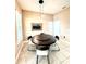 Cozy dining area featuring a round dark wood table with a lazy susan and contemporary chairs at 9207 Busaco Park Way, Winter Garden, FL 34787