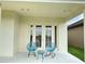 Charming patio with comfortable seating; great for relaxing and enjoying the outdoors at 9207 Busaco Park Way, Winter Garden, FL 34787