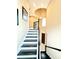 Elegant staircase with dark wood and white risers leading to the upper level at 9207 Busaco Park Way, Winter Garden, FL 34787