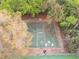 Overhead view of a community basketball court surrounded by mature trees and greenery at 958 High Point Loop, Longwood, FL 32750