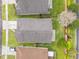Aerial perspective showcases a tidy backyard with a patio and manicured landscaping at 958 High Point Loop, Longwood, FL 32750