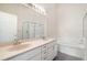 Bathroom featuring double sinks, large mirror, and a bathtub with shower at 958 High Point Loop, Longwood, FL 32750