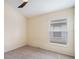 Cozy bedroom with neutral carpet, ceiling fan, and window at 958 High Point Loop, Longwood, FL 32750