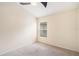 Empty bedroom with neutral carpet, ceiling fan, and window at 958 High Point Loop, Longwood, FL 32750