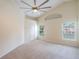 Light, bright bedroom with vaulted ceiling, carpet, and windows overlooking landscaped yard at 958 High Point Loop, Longwood, FL 32750