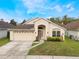 Charming single-story home with well-maintained lawn, attached garage and welcoming front entrance at 958 High Point Loop, Longwood, FL 32750