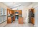 Bright kitchen features granite counters, stainless appliances, and tile floors at 958 High Point Loop, Longwood, FL 32750