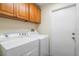 Bright laundry room with modern washer and dryer at 958 High Point Loop, Longwood, FL 32750