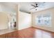 Bright open living area featuring hard surface flooring, neutral walls, and a large window at 958 High Point Loop, Longwood, FL 32750