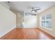 Bright living room with hard surface flooring and large window offering natural light and an open concept at 958 High Point Loop, Longwood, FL 32750